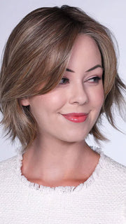 Model is wearing FERRARI By BELLETRESS in color SUNKISSED ALMOND R | A blend of Medium and Light Brown with Light Gold Blonde Highlights and a hint of Cooler Blonde, rooted with Medium and Light Brown