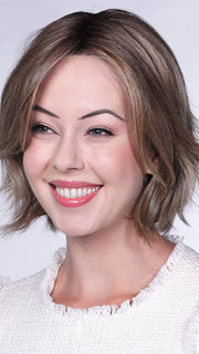 Model is wearing FERRARI By BELLETRESS in color SUNKISSED ALMOND R | A blend of Medium and Light Brown with Light Gold Blonde Highlights and a hint of Cooler Blonde, rooted with Medium and Light Brown