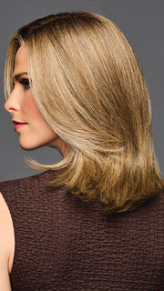 Model is wearing OWN THE ROOM LUXURY in color GF12-22 SS CAPPUCCINO | Light Golden Brown Evenly Blended with Cool Platinum Blonde Highlights with Dark Roots
