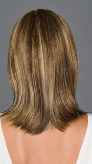 Model is wearing ILLUMINATION by GABOR in color BROWN-BLONDE | Medium to Light Brown with Salon Highlights