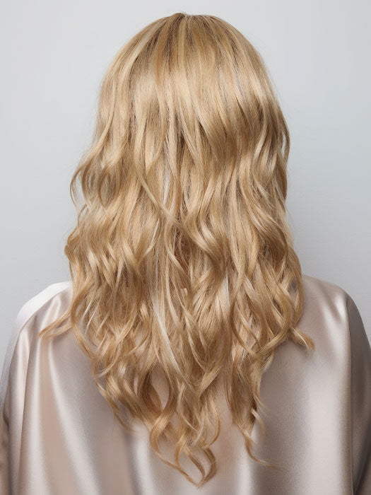 Model is wearing HANA by NORIKO in color Light Ash Blond R | Cream Ash Blonde with ash brown and white-grey roots that blend into a variety of ash blonde tones, including ash pearl blonde, creamy ivory, and pale cream