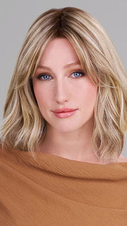 Model is wearing HOLLIE PETITE by JON RENAU in color 12FS12 MALIBU BLONDE | Light Gold Brown, Light Natural Gold Blonde, Pale Natural Gold-Blonde Blend, Shaded with Light Gold Brown