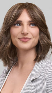 Model is wearing HOLLIE PETITE by JON RENAU in color 8RH14 MOUSSE CAKE | Medium Brown with 33% Medium Natural Blonde Highlights