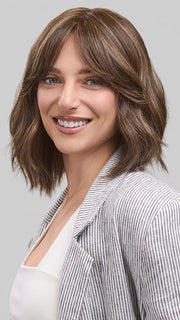 Model is wearing HOLLIE PETITE by JON RENAU in color 8RH14 MOUSSE CAKE | Medium Brown with 33% Medium Natural Blonde Highlights