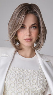 Model is wearing MIRA by AMORE in color TRES CHOCOLATE R | Carefully placed White, Medium, and Dark Chocolate tones completed with a Dark Brown Root. This color is perfect for both Blond and Brown enthusiasts.   