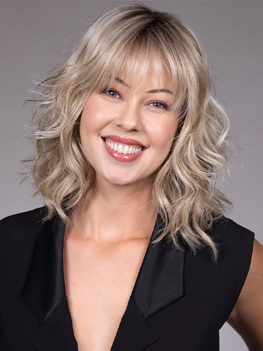 Model is wearing JIL in BUTTERBEER R | Dark Brown Base and Root that transitions smoothly into a buttery blonde, infused with creamy honey and toffee tones