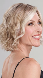 Model is wearing JANUARY by JON RENAU in color 101/88/27S8 CATALINA BLONDE | Pale blonde with Pure White Natural Violet halo highlights, shaded medium brown