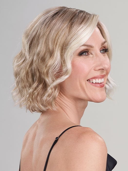 Model is wearing JANUARY by JON RENAU in color 101/88/27S8 CATALINA BLONDE | Pale blonde with Pure White Natural Violet halo highlights, shaded medium brown