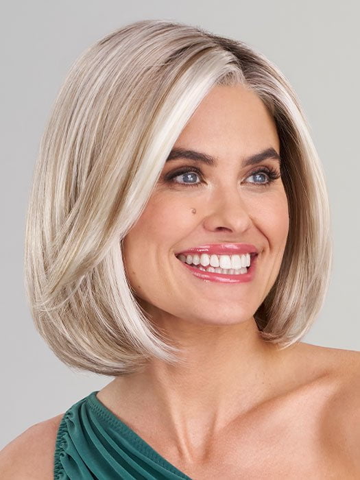 Model is wearing KRISTEN by JON RENAU in color 101/88/27S8 CATALINA BLONDE | Pale blonde with Pure White Natural Violet halo highlights, shaded medium brown