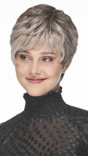 This pixie wig has a layered short top, textured fringe, and tapered back