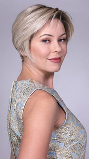 Model is wearing LENOX By BELLETRESS in CRUSHED-ALMOND-BLONDE-R | A Soft Neutral Light Blonde with a Light and Medium Blended Root Color