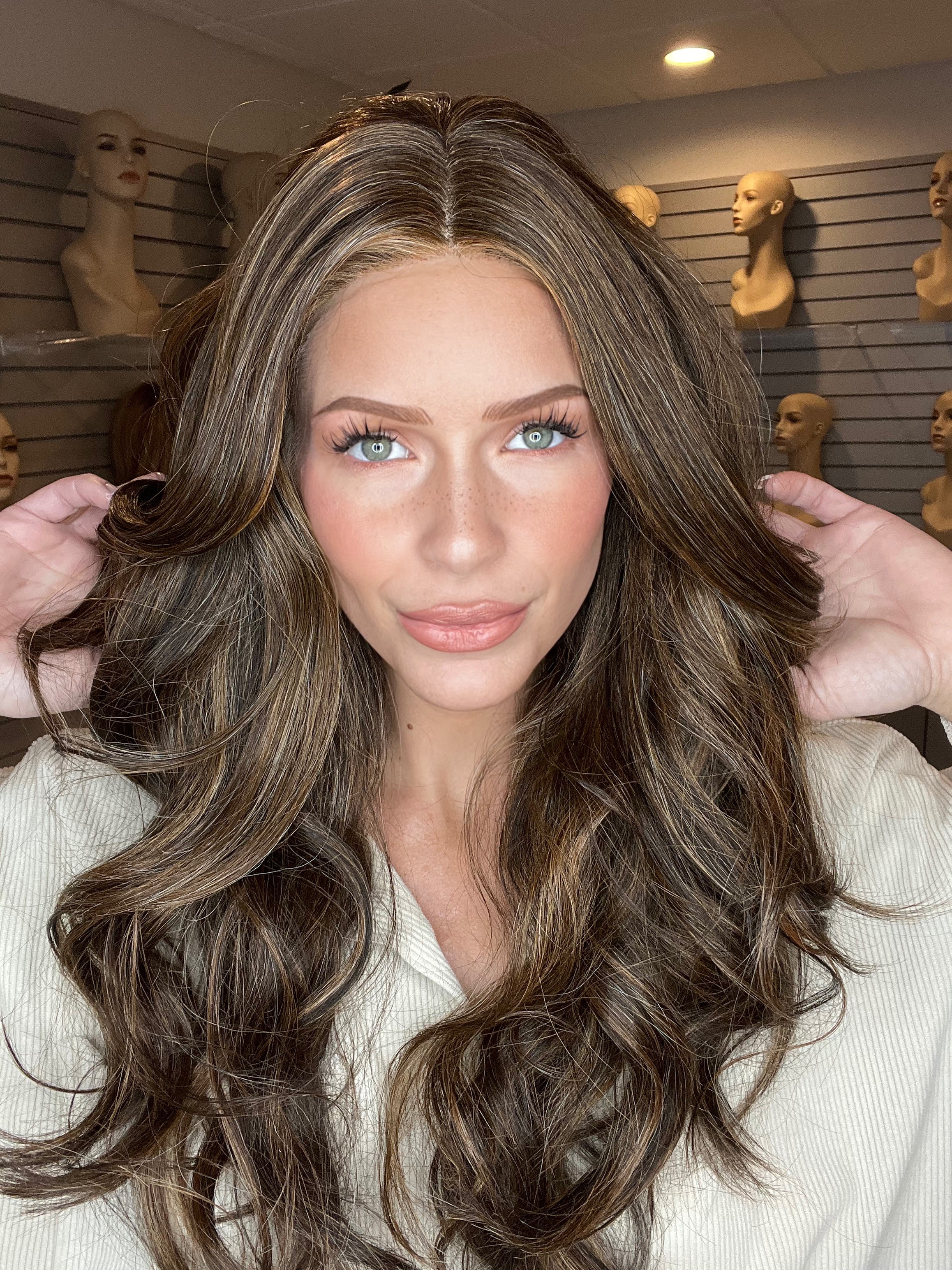Madeline is wearing LONG TOUSLED by HAIRDO in R829S+ GLAZED HAZELNUT | Rich Medium Brown with Ginger Highlights on Top
