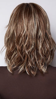 Model is wearing LORYN in SNOWY UMBER R | Medium Ginger Brown base with White Blond highlights