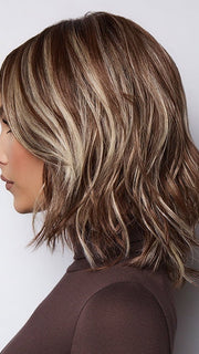 Model is wearing LORYN in SNOWY UMBER R | Medium Ginger Brown base with White Blond highlights