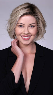 Model is wearing CRUSHED ALMOND BLONDE R | A soft Neutral Light Blonde with a Light and Medium Blended Root Color.