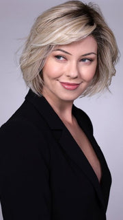 Model is wearing CRUSHED ALMOND BLONDE R | A soft Neutral Light Blonde with a Light and Medium Blended Root Color.