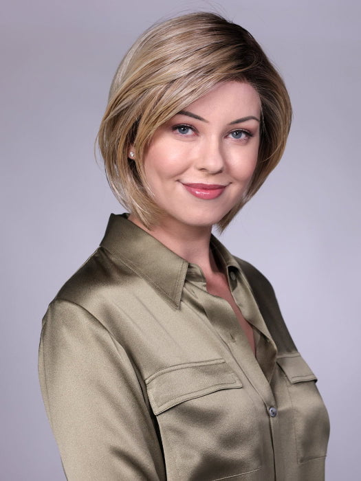 Model is wearing MANCHESTER in RAW SUGAR BLONDE | A Neutral Light Blonde, Honey Blonde, Pale Gold Blonde, with a base of Light Brown Low Lights featuring a Medium Root Color