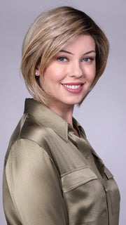 Model is wearing MANCHESTER in RAW SUGAR BLONDE | A Neutral Light Blonde, Honey Blonde, Pale Gold Blonde, with a base of Light Brown Low Lights featuring a Medium Root Color