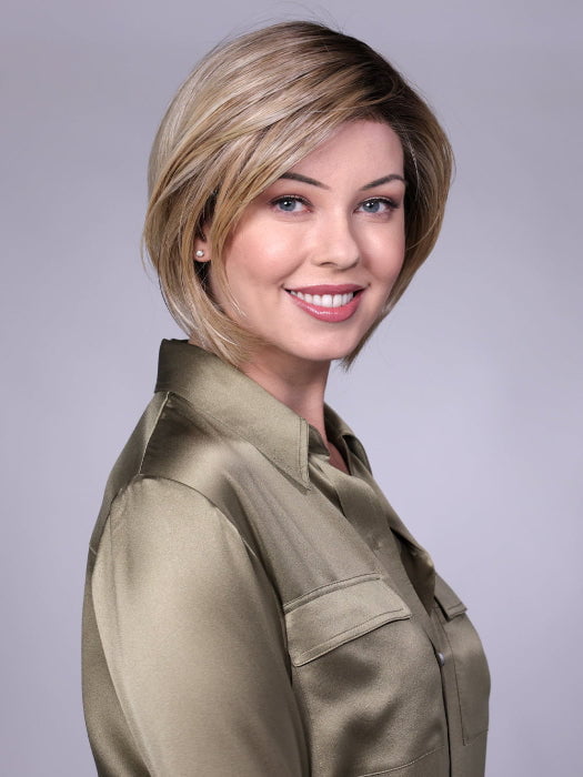 Model is wearing MANCHESTER in RAW SUGAR BLONDE | A Neutral Light Blonde, Honey Blonde, Pale Gold Blonde, with a base of Light Brown Low Lights featuring a Medium Root Color