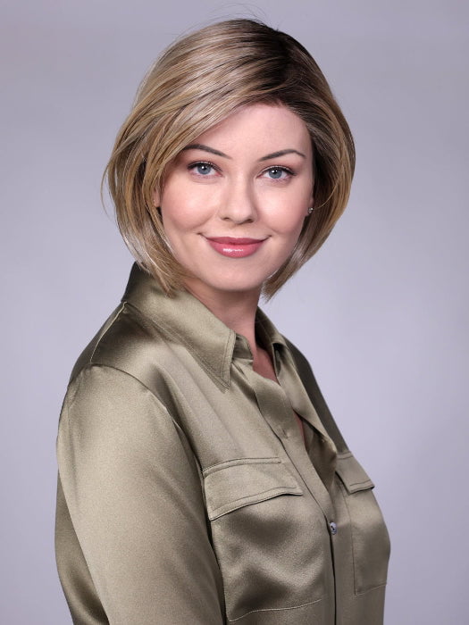 Model is wearing MANCHESTER in RAW SUGAR BLONDE | A Neutral Light Blonde, Honey Blonde, Pale Gold Blonde, with a base of Light Brown Low Lights featuring a Medium Root Color