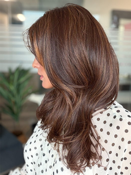 Roxie is wearing MARGO in color GLAZED AUBURN R | Stunning fusion of deep red, medium copper, and dark chocolate root.