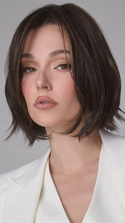Model is wearing MIRA by AMORE in color SPICED MOCHA R | A dark-brown base with perfectly placed warm-medium brown and medium reddish-brown highlights. The root tone adds a natural shadowed effect.