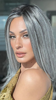 Model is wearing MIRROR MOMENT by GABOR in color GF44-60SS SUGARED LICORICE | Salt Dark Brown with Subtle Warm Highlights Roots