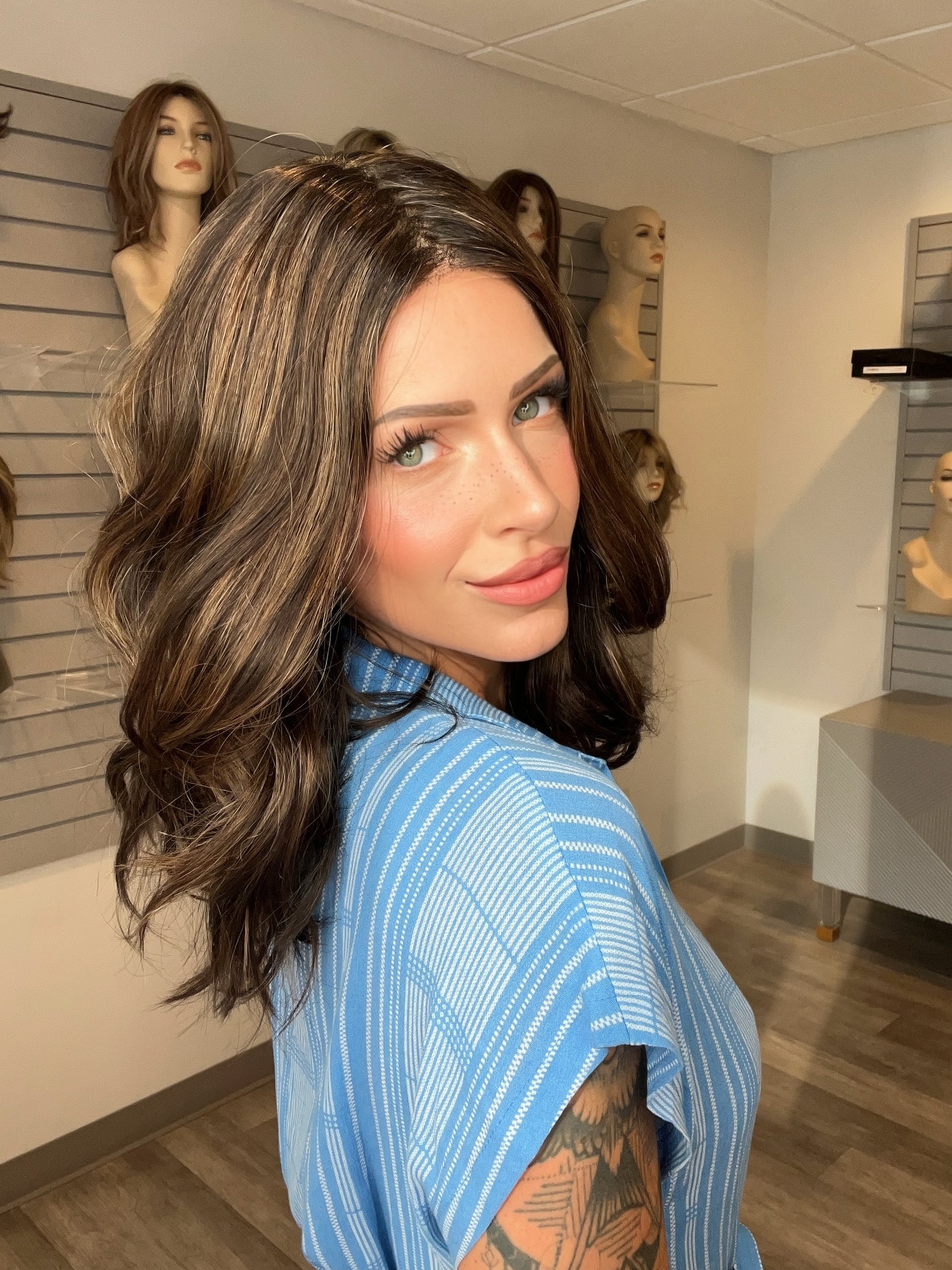 Madeline wearing MOLLY by ENVY in AMARETTO CREAM | Dark Brown roots with overall Medium Brown base with Honey Blonde highlights