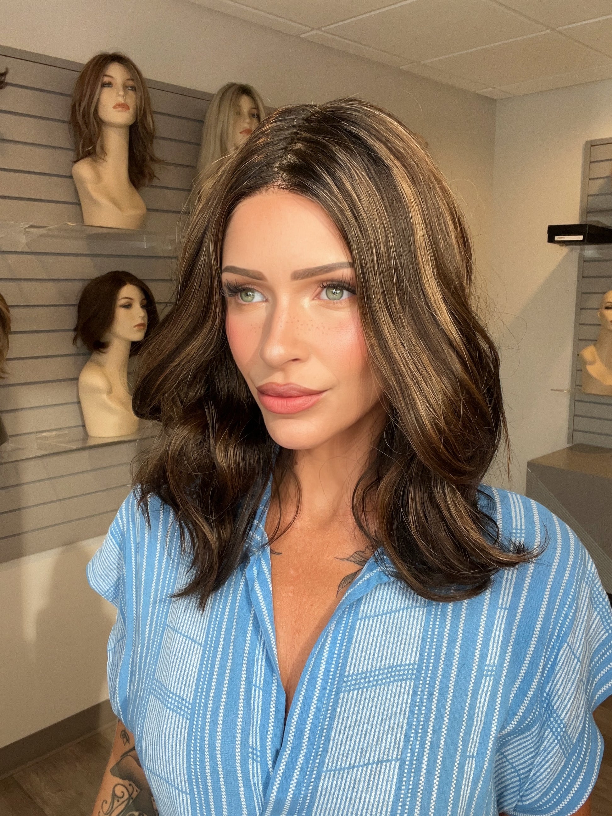Madeline wearing MOLLY by ENVY in AMARETTO CREAM | Dark Brown roots with overall Medium Brown base with Honey Blonde highlights