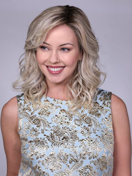 Model is wearing MORGAN By BELLETRESS in CRUSHED-ALMOND-BLONDE-R | A Soft Neutral Light Blonde with a Light and Medium Blended Root Color