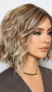 A Bohemian-inspired hairstyle with beachy waves and choppy layers