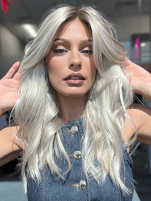 Model is wearing OLIVIA by JON RENAU in color FS17/101S18 PALM SPRINGS BLONDE | Light Ash Blonde with Pure White Natural Violet Bold Highlights, Shaded with Dark Natural Ash Blonde