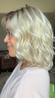 Brea @getwiggywithbrea wearing ARLO by ESTETICA in color SUNLIT-BLONDE | Soft Blend of Sandy Blonde, Lightest Blonde and Iced Blonde with a Light Golden Brown Root
