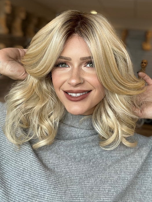 Madeline is wearing AURORA by JON RENAU in FS24/102S12 LAGUNA BLONDE | Light Natural Gold Blonde with Pale Natural Gold Blonde bold highlights, Shaded with Light Gold Brown