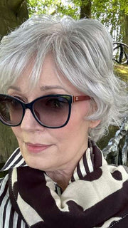 Mel B. @mels.be.ageless wearing VOLTAGE ELITE by RAQUEL WELCH WIGS in color R56/60 SILVER MIST | Lightest Gray with 20% Medium Brown Evenly Blended with Pure White