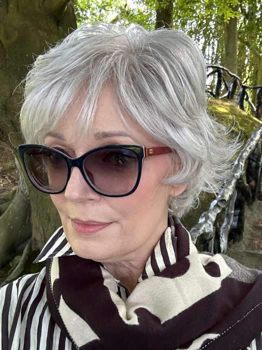 Mel B. @mels.be.ageless wearing VOLTAGE ELITE by RAQUEL WELCH WIGS in color R56/60 SILVER MIST | Lightest Gray with 20% Medium Brown Evenly Blended with Pure White
