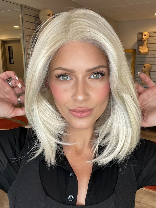 Madeline is wearing STRAIGHT TO CAMERA by RAQUEL WELCH in RL16/22 ICED SWEET CREAM | Pale Blonde with Slight Platinum Highlighting