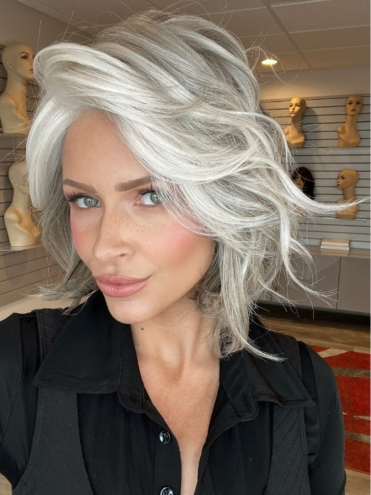 Madeline is wearing WAVES AND RAVES by RAQUEL WELCH in RL51/61 ICED GRANITA | Lightest Grey Progresses to a Deep Grey at the Nape