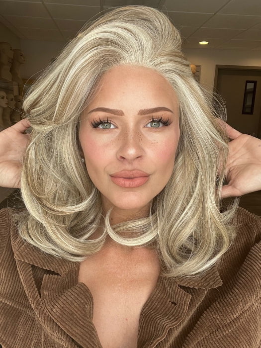 Madeline is wearing SHOWRUNNER by RAQUEL WELCH in RL19/23 BISCUIT | Light Ash Blonde Evenly Blended with Cool Platinum Blonde