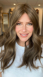 Madeline is wearing SELFIE MODE by RAQUEL WELCH in RL10/12 SUNLIT CHESTNUT | Light Chestnut Brown Evenly Blended with Light Brown