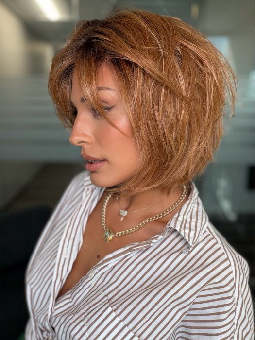 Roxie wearing TESS by ELLEN WLLE in PUMPKIN ROOTED | Dark Strawberry Blonde with Light Reddish Auburn and Copper Red Blend With Shaded Roots