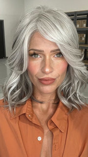 Madeline wearing BRADSHAW by BELLETRESS in COCONUT MILK GRAY | A soft, modern blend of creamy off-white and gentle gray tones, creating a pearlescent, silvery finish.