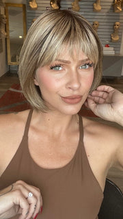 Madeline is wearing SING by ELLEN WILLE in SAND MULTI ROOTED 14.22.12 | Medium Ash Blonde Blended with Light Neutral Blonde and Lightest Brown with Shaded Roots