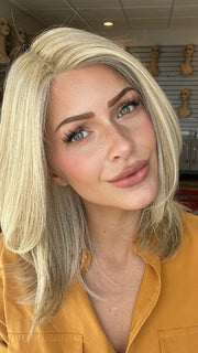 Madeline is wearing OWN THE ROOM by GABOR in GF19-23 BISCUIT | Light Ash Blonde Evenly Blended with Cool Platinum Blonde