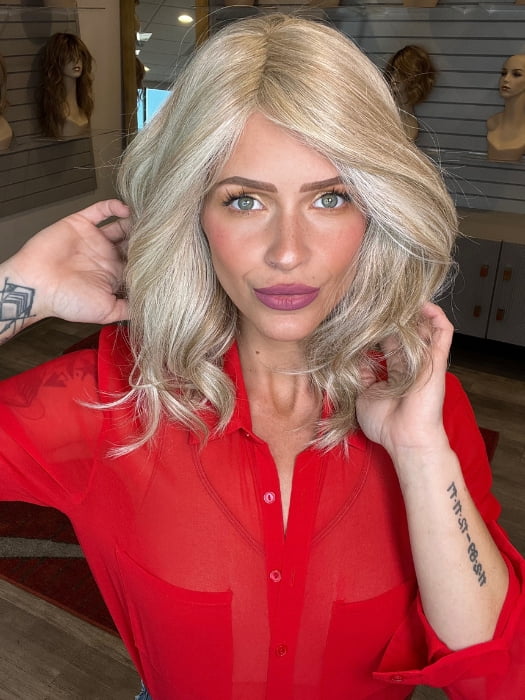 Madeline wearing BELLA VIDA BY RAQUEL WELCH in RL19/23 BISCUIT | Light Ash Blonde Evenly Blended with Cool Platinum Blonde