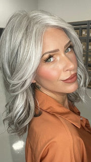 Madeline wearing BRADSHAW by BELLETRESS in COCONUT MILK GRAY | A soft, modern blend of creamy off-white and gentle gray tones, creating a pearlescent, silvery finish.