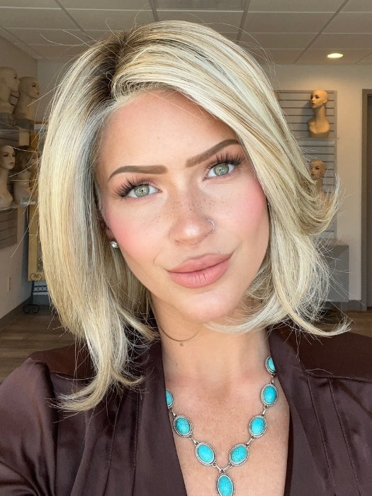 Madeline is wearing UPSTAGE by RAQUEL WELCH WIGS in color RL19/23SS SHADED BISCUIT | Light Ash Blonde Evenly Blended with Cool Platinum Blonde with Dark Roots 