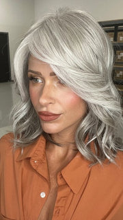 Madeline wearing BRADSHAW by BELLETRESS in COCONUT MILK GRAY | A soft, modern blend of creamy off-white and gentle gray tones, creating a pearlescent, silvery finish.
