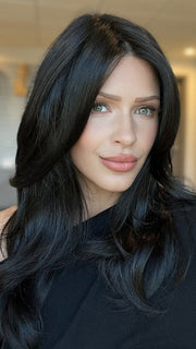 Madeline is wearing COURTNEY by JON RENAU in 1B | Soft Black 
