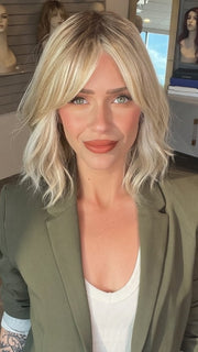 Madeline wearing HOLLIE by JON RENAU in 101/88/27S8 CATALINA BLONDE | Pale blonde with Pure White Natural Violet halo highlights, shaded medium brown